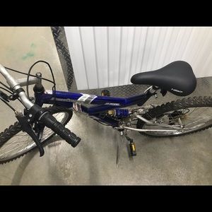 Blue mountain bike one flat tire